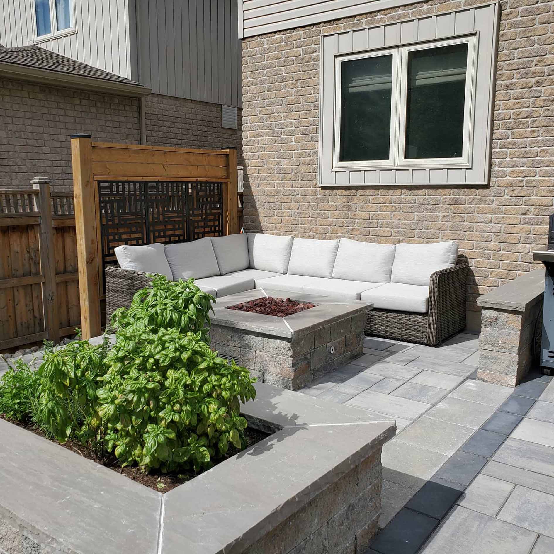 A Patio With A Fire Pit And A Couch